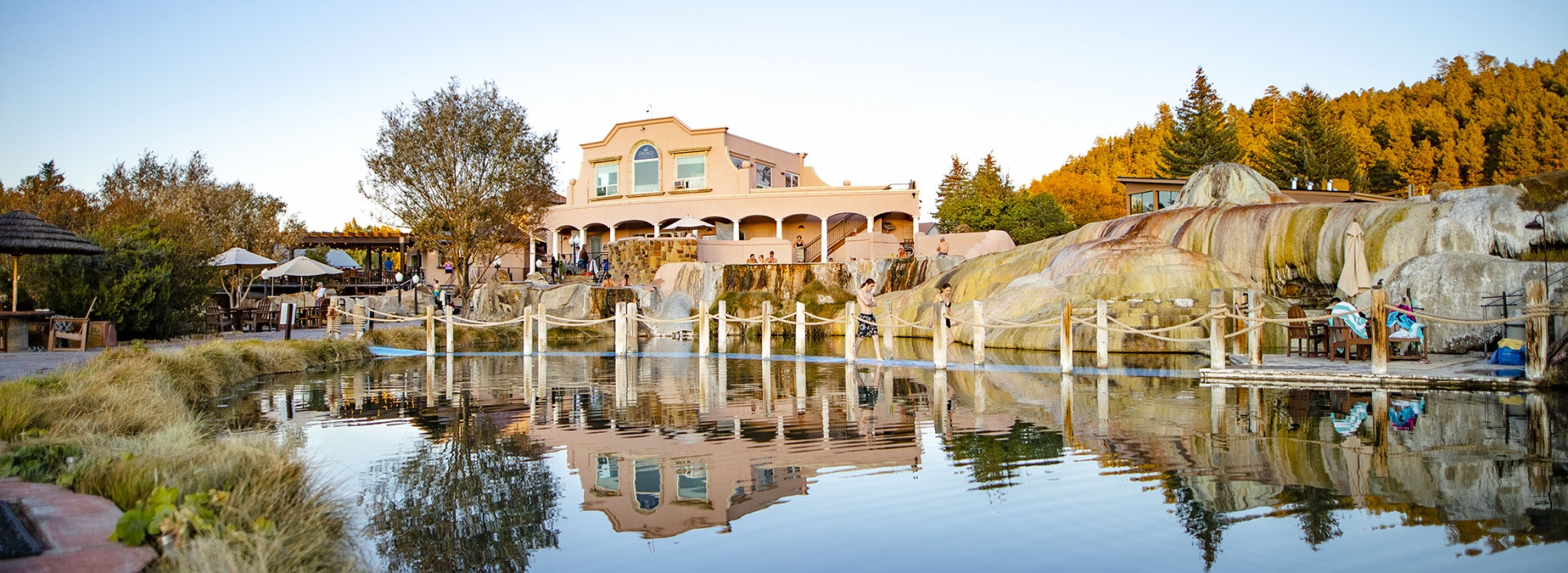 body of water with resort on the horizon