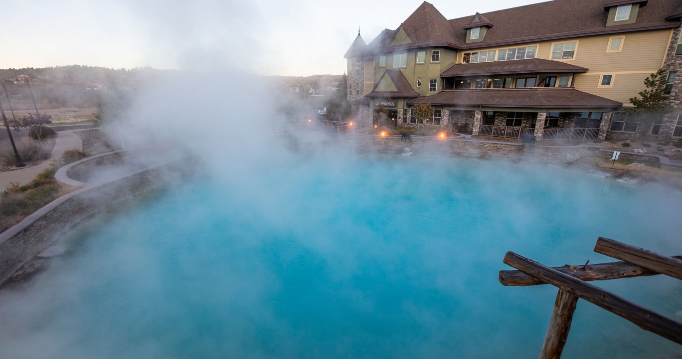 steam coming off a pool infront of a building