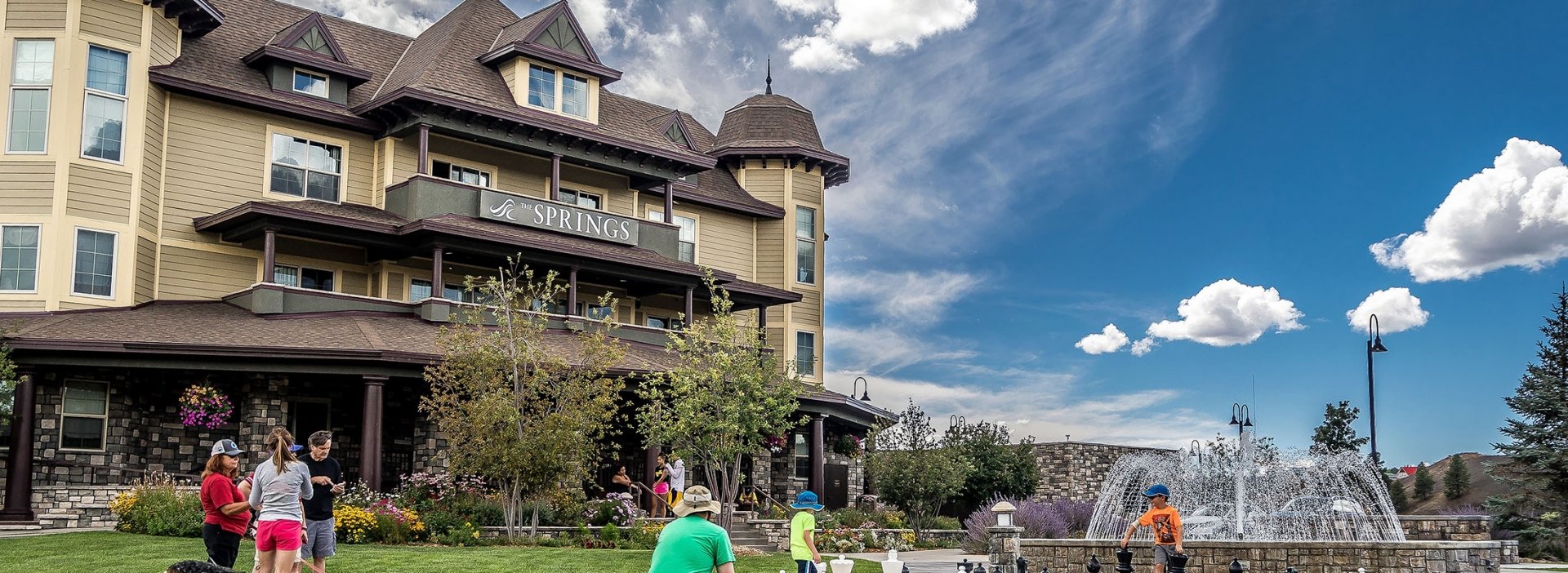 kids playing chess on a lawn in the summer