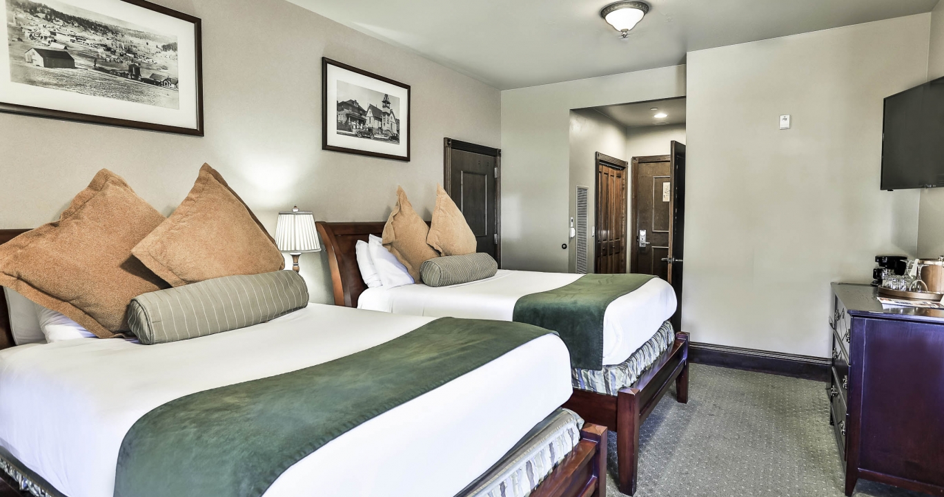 Twin beds in the Junior Lux suite at The Springs Resort