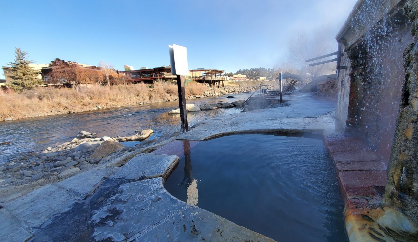 Water fall filling the pool next to the San Juan River