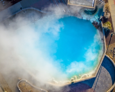 Aerial view of the steam rising from the hot spring pool