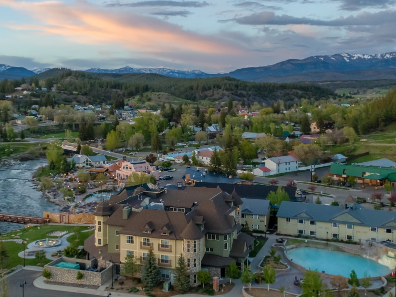 An aerial view of The Springs Resort at sunset