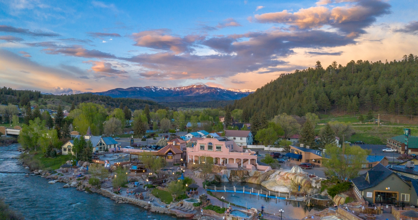 An aerial view of The Springs Resort at sunset