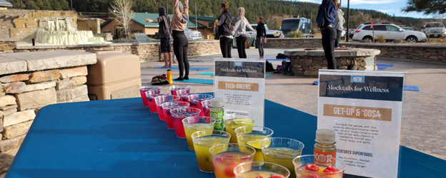 Rows of mocktails in cups and two 