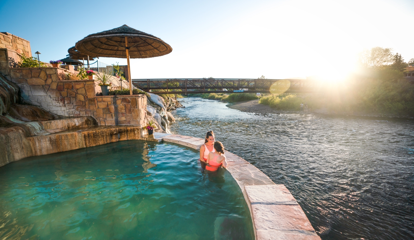 Friends In The Hot Springs Overlooking The River