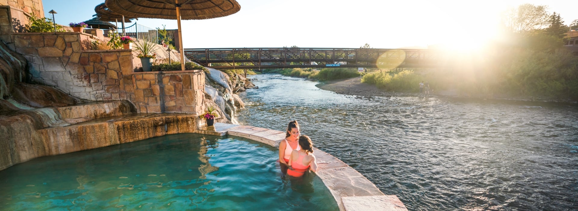 Friends In The Hot Springs Overlooking The River