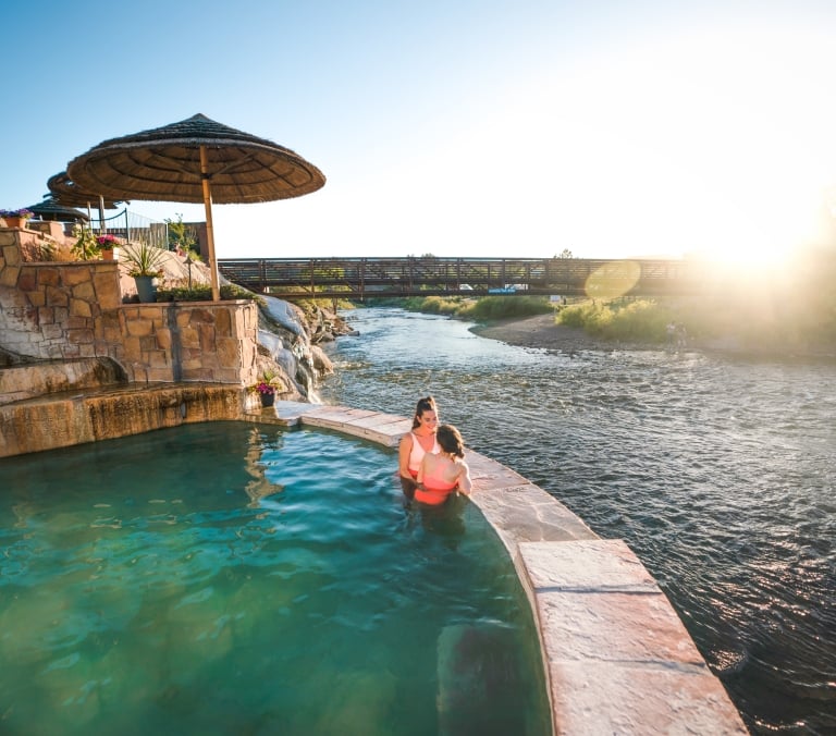 Friends In The Hot Springs Overlooking The River