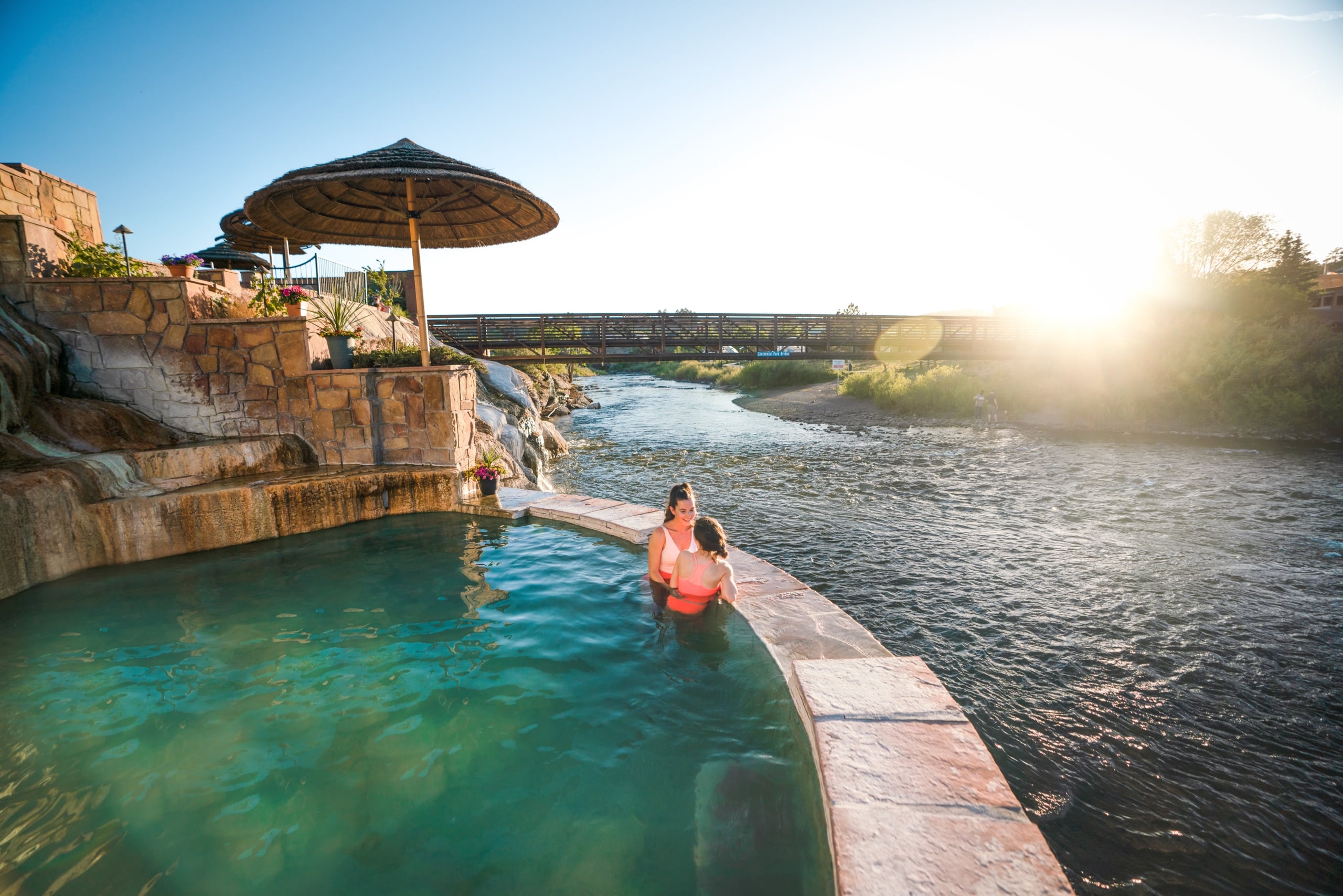 Friends In The Hot Springs Overlooking The River