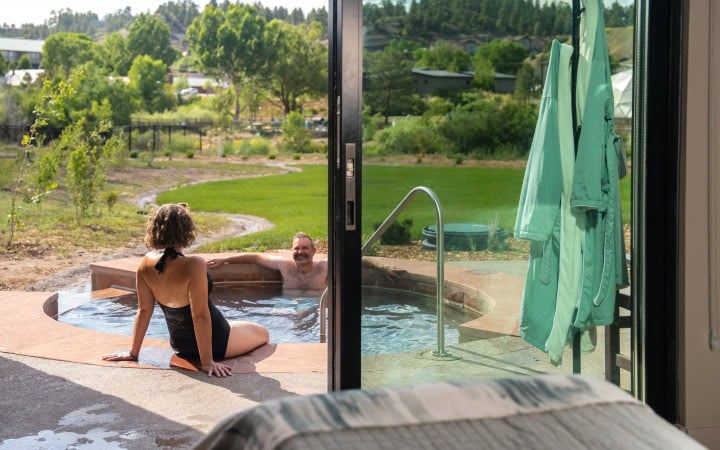 Relaxing hot tub at The Springs Resort with scenic outdoor view.