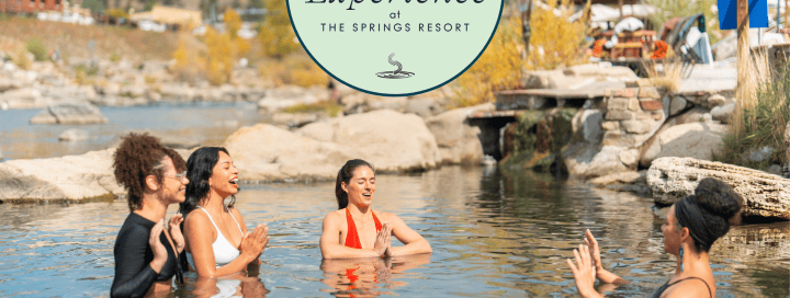 Guests enjoying thermal waters at The Springs Resort in a scenic outdoor setting.