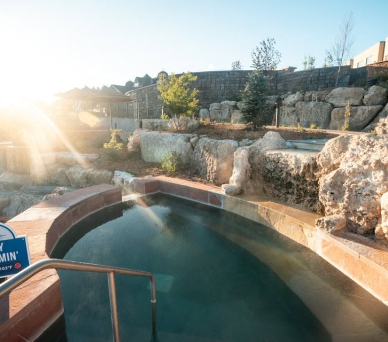 A steaming hot spring pool, marked 