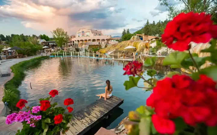 Relaxing woman enjoying the hot springs at The Springs Resort, Pagosa Springs.