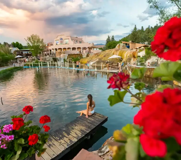 Relaxing woman enjoying the hot springs at The Springs Resort, Pagosa Springs.