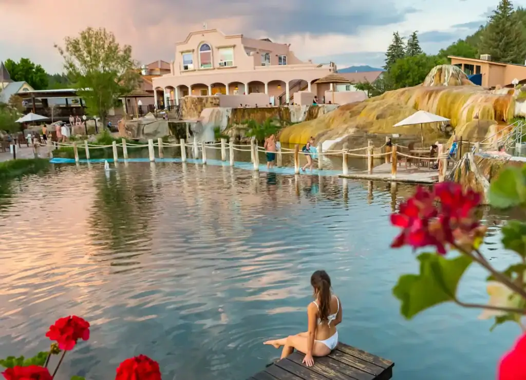 Guest relaxing beside the geothermal pools at The Springs Resort