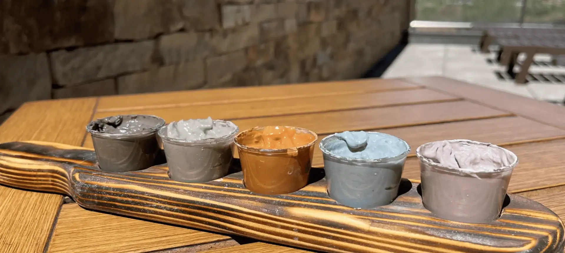 Colorful spa hot springs on a wooden tray at The Springs Resort.