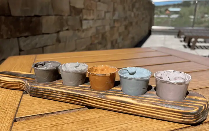 Colorful spa hot springs on a wooden tray at The Springs Resort.