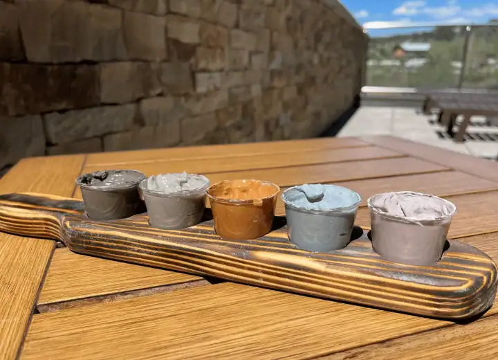 Colorful spa hot springs on a wooden tray at The Springs Resort.